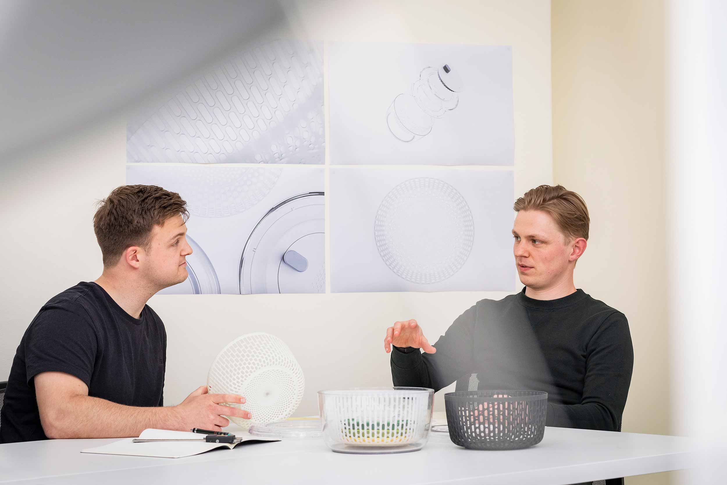 Two product designers in project review session